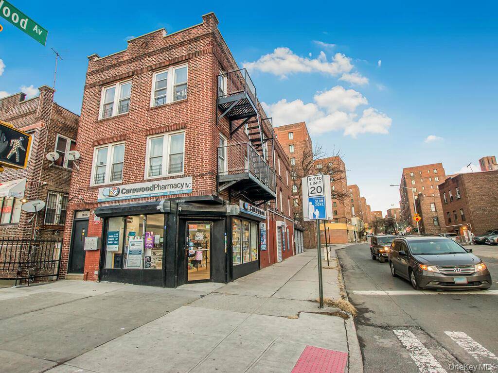 Detached brick mixed use building with R6 zoning located on busy White Plains Road near Hugh J.