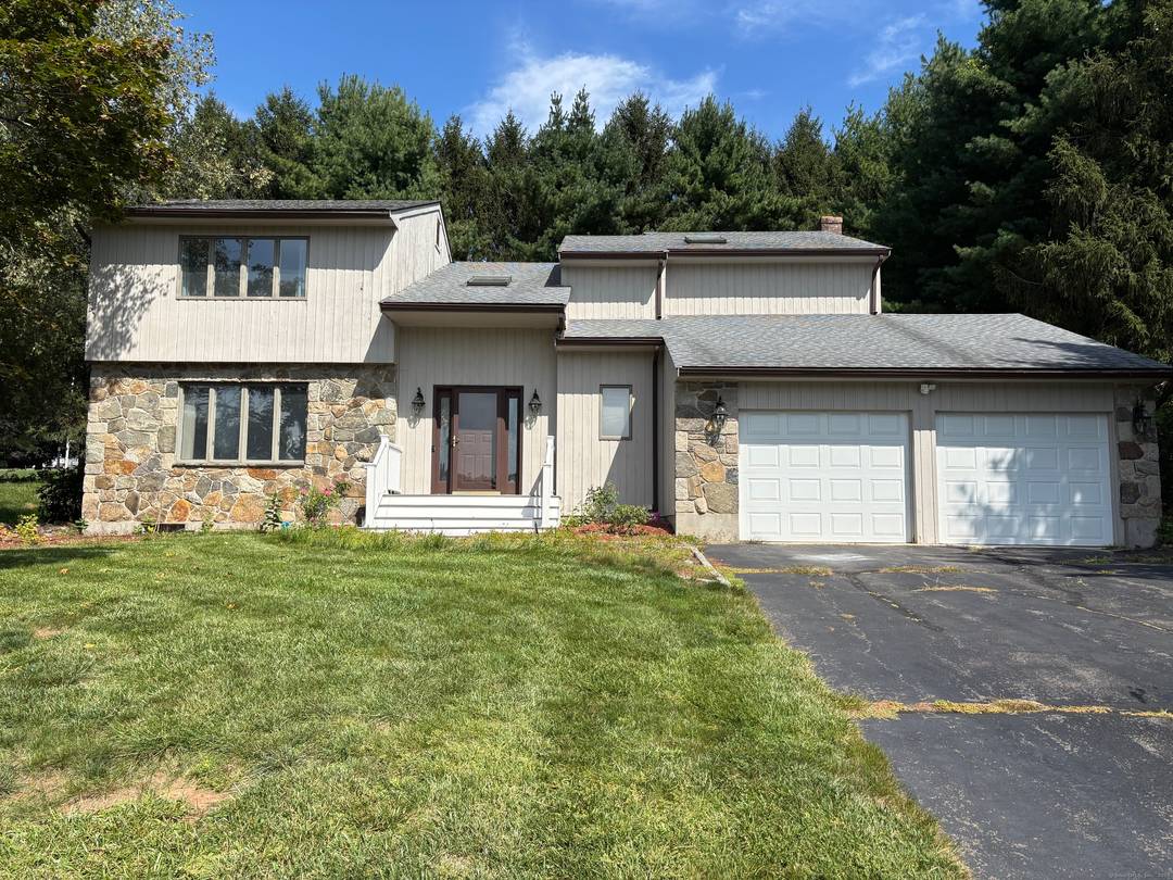 Welcome to this contemporary style home located at 11 Kupchunos Dr in South Windsor, CT.