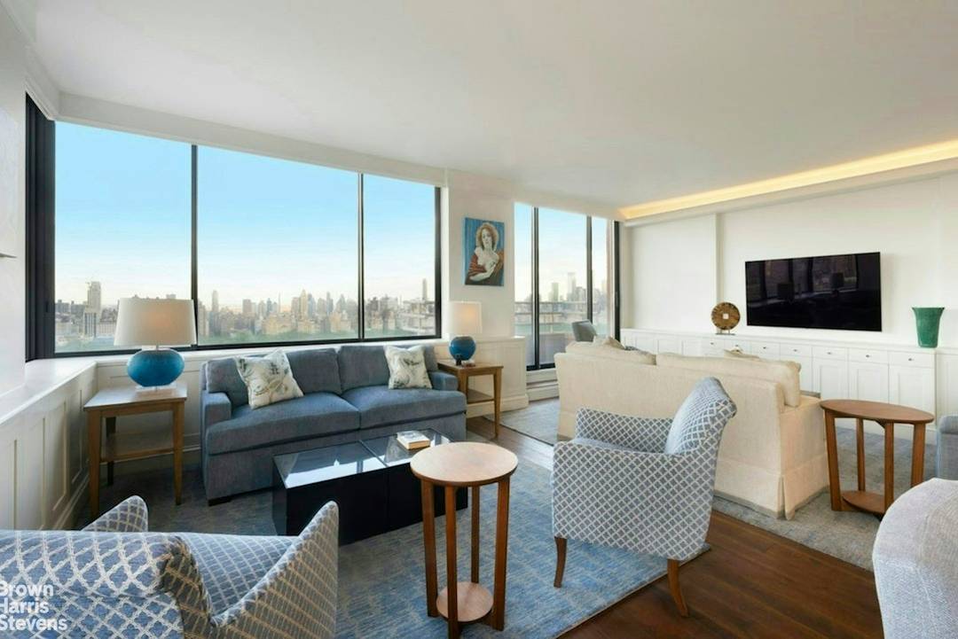 Perched high in the tower, this rare corner residence offers a remarkable opportunity to own a gracious 2 3 bedroom home with sweeping, unobstructed panoramic views of Central Park, the ...