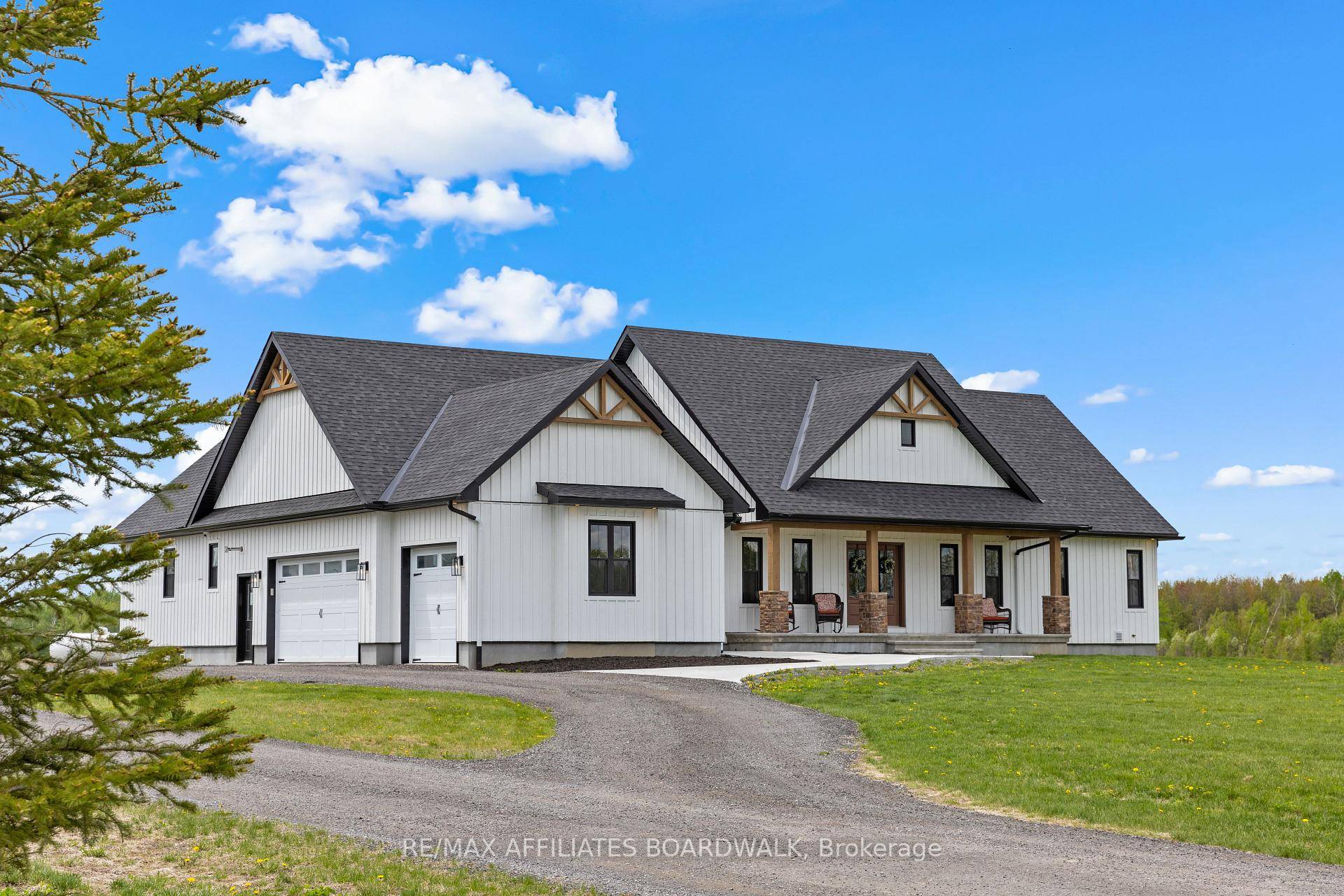 Experience the pinnacle of modern farmhouse luxury in this meticulously crafted 2021 custom bungalow, perfectly situated on 3 acres.