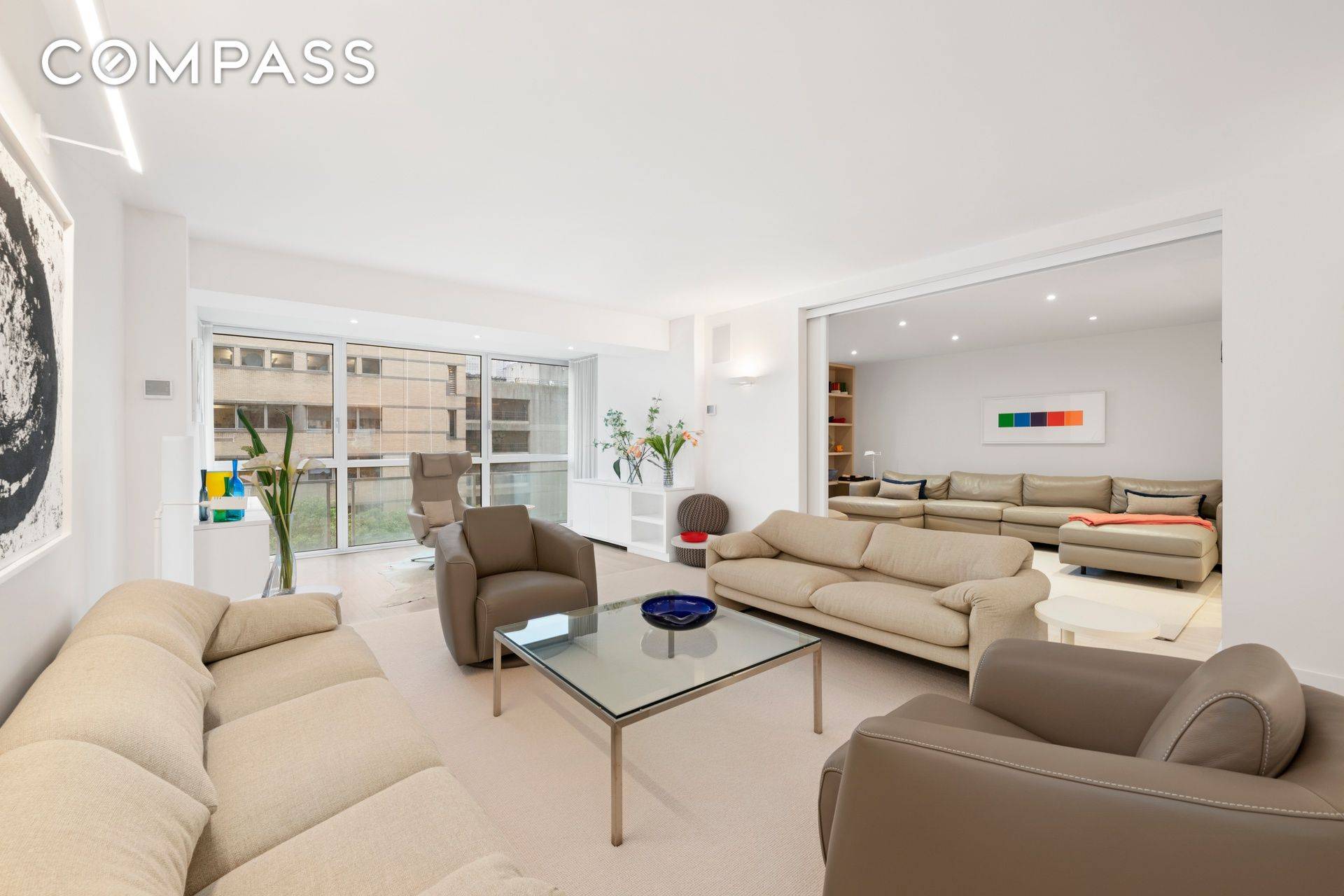 Embrace pristine modern living in this stunning three bedroom, three bathroom co op featuring light and bright interiors, exceptional storage, and open sky views in a full service postwar building.