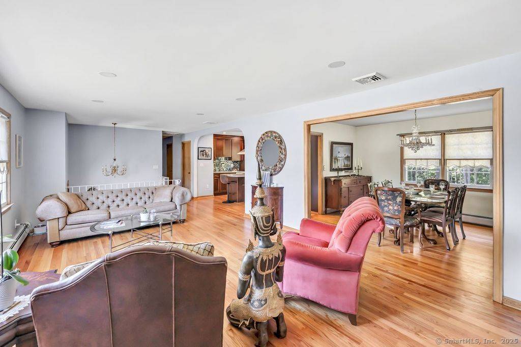 Extremely well maintained Raised Ranch located on a large level corner lot This light and Bright home offers many additional features Large and bright living room with fireplace, new designer ...