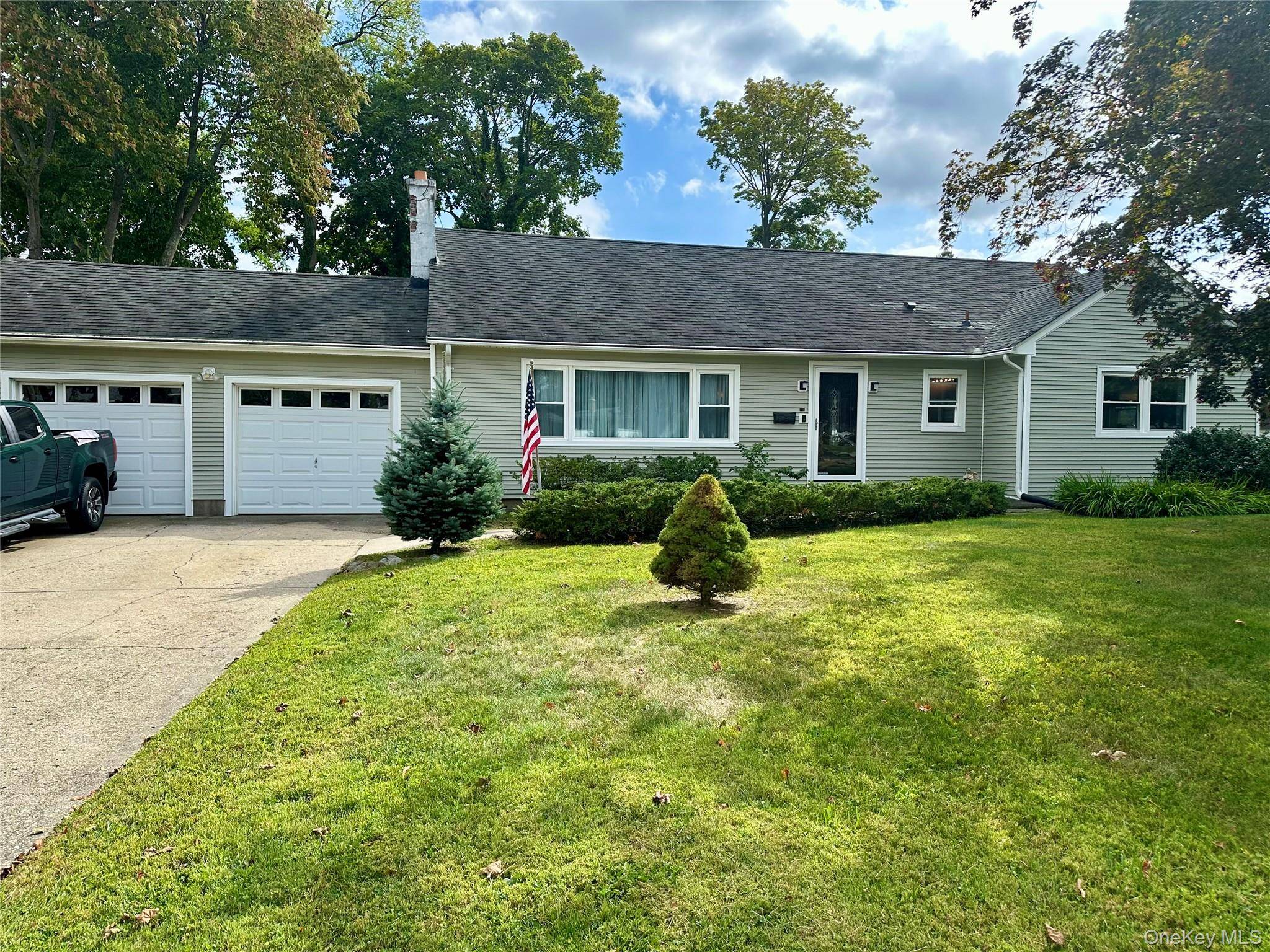 Welcome to 406 Moriches Road, a home designed to bring families together.