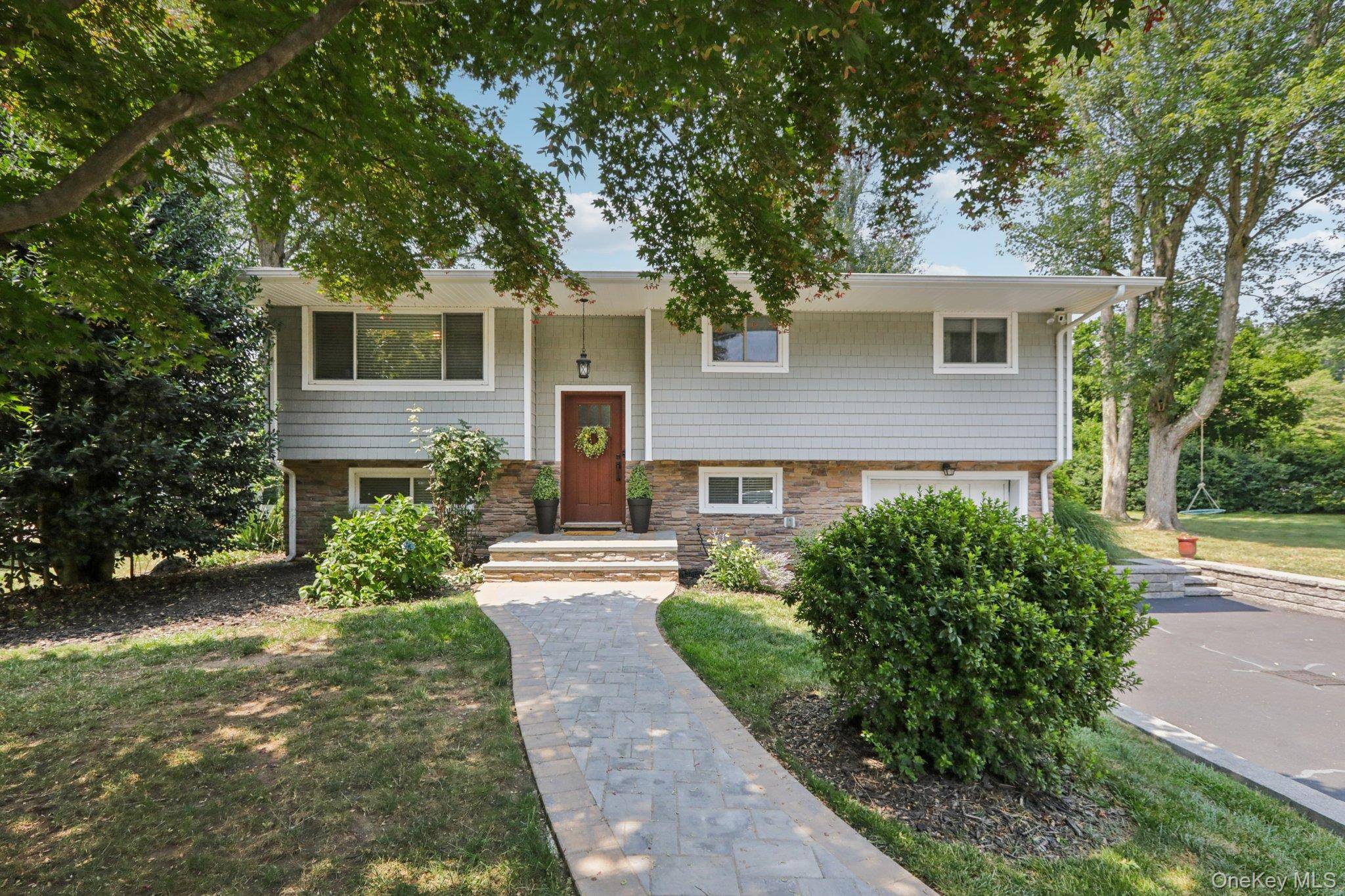 Beautiful and well maintained Hi Ranch home located on a quiet street in the heart of Valley Cottage.
