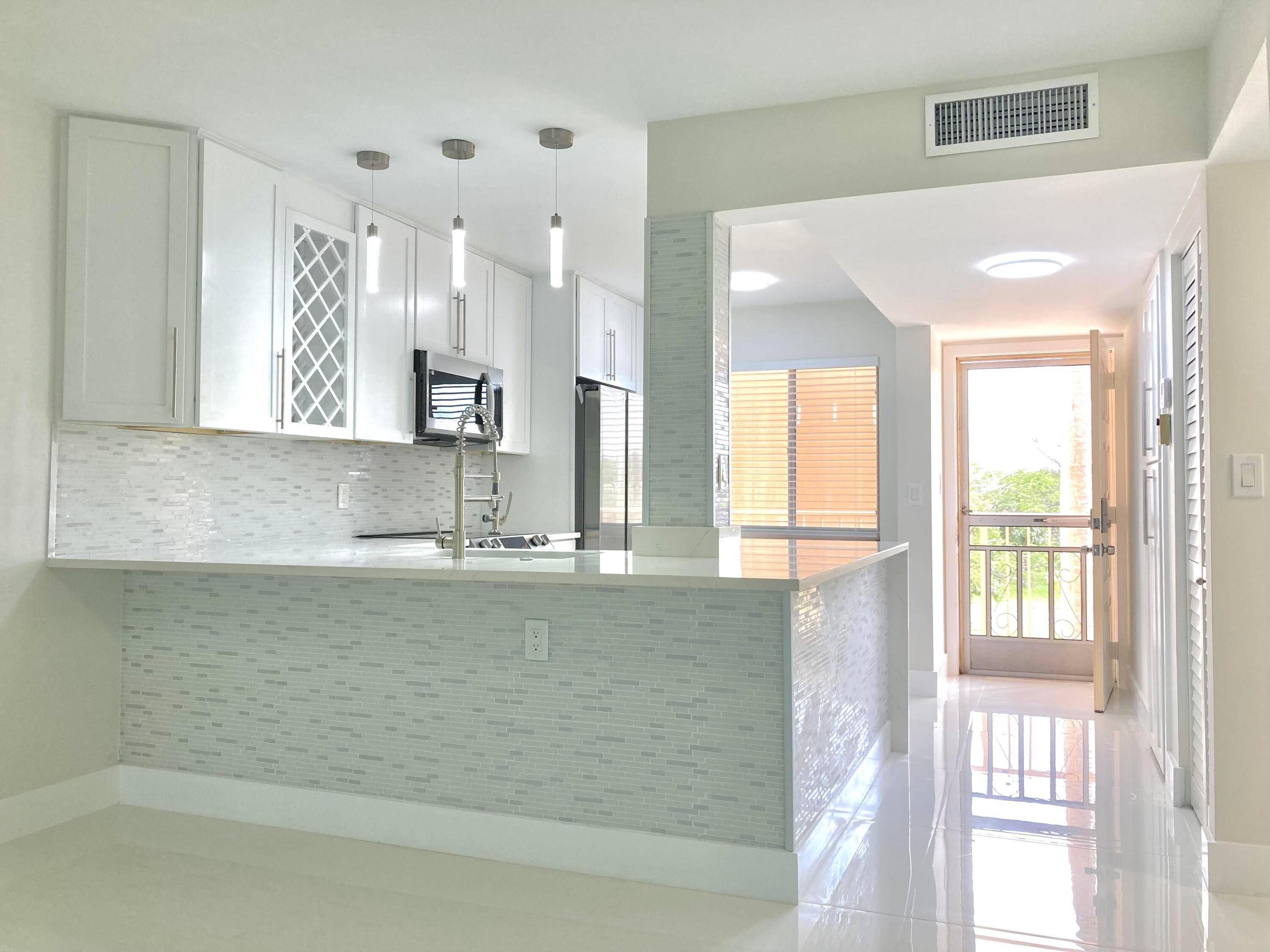 FULLY RENOVATED ! 2bd 2ba condo in the desired active 55 community of Huntington Lakes.