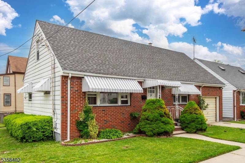 Three bedrooms, living room, dining room, kitchen, and 1.
