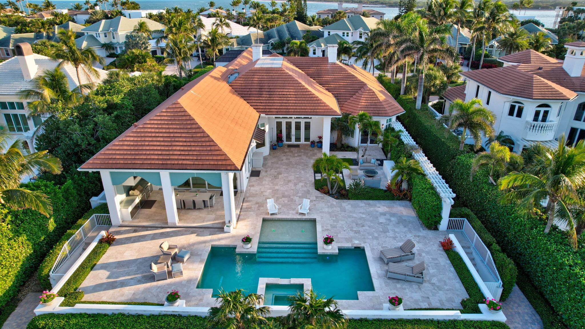 Discover your coastal contemporary dream home in the prestigious community of Sailfish Point.