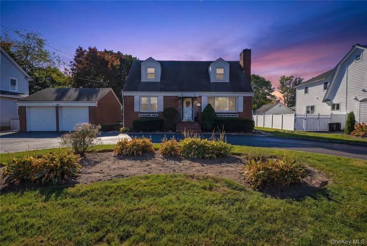Decades of memories were made in this brick cape, and every room still carries the warmth of a home that was well loved and well lived in.