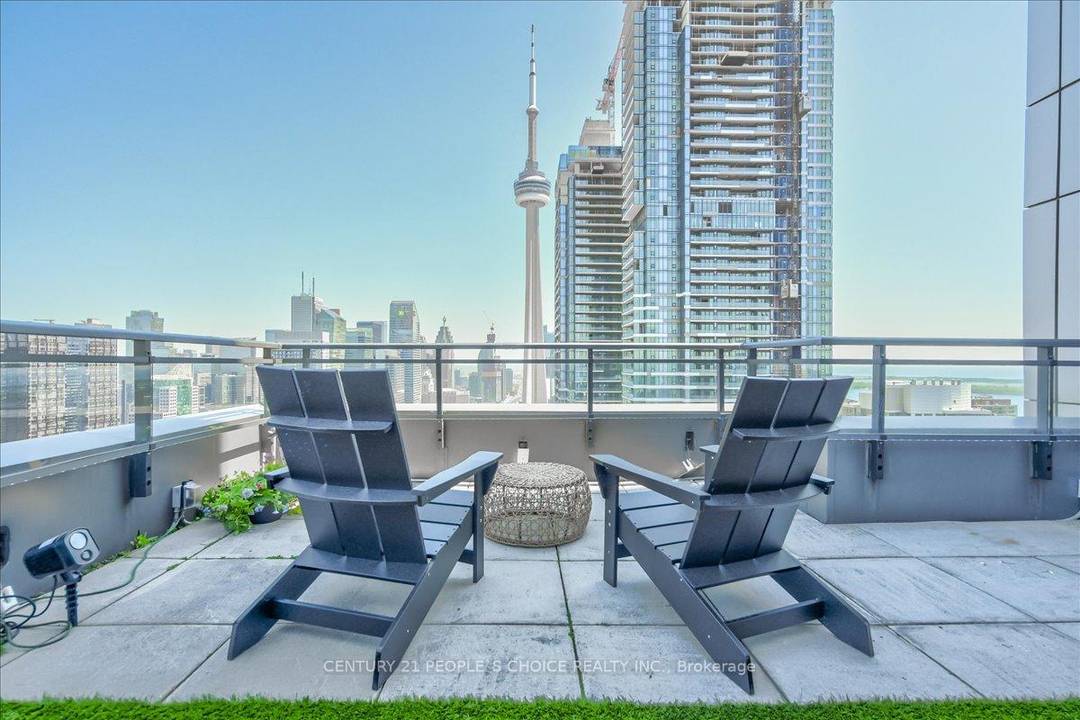 Discover a rare two storey penthouse at 25 Telegram Mews, all inclusive fully furnished featuring an expansive private terrace with breathtaking city skyline and Lake Ontario views.