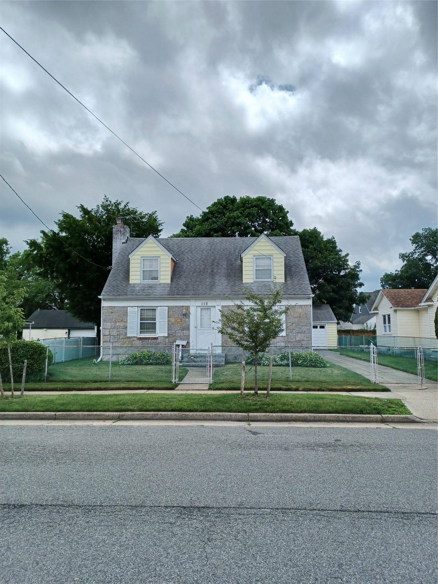 Welcome to 118 Allen Street in Hempstead, NY A classic Cape Cod style home brimming with character, charm, and renovation potential.