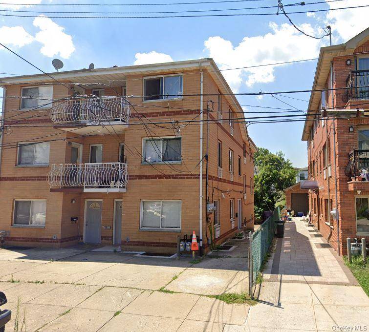 Welcome to this unique all brick two family home in the heart of bayside !