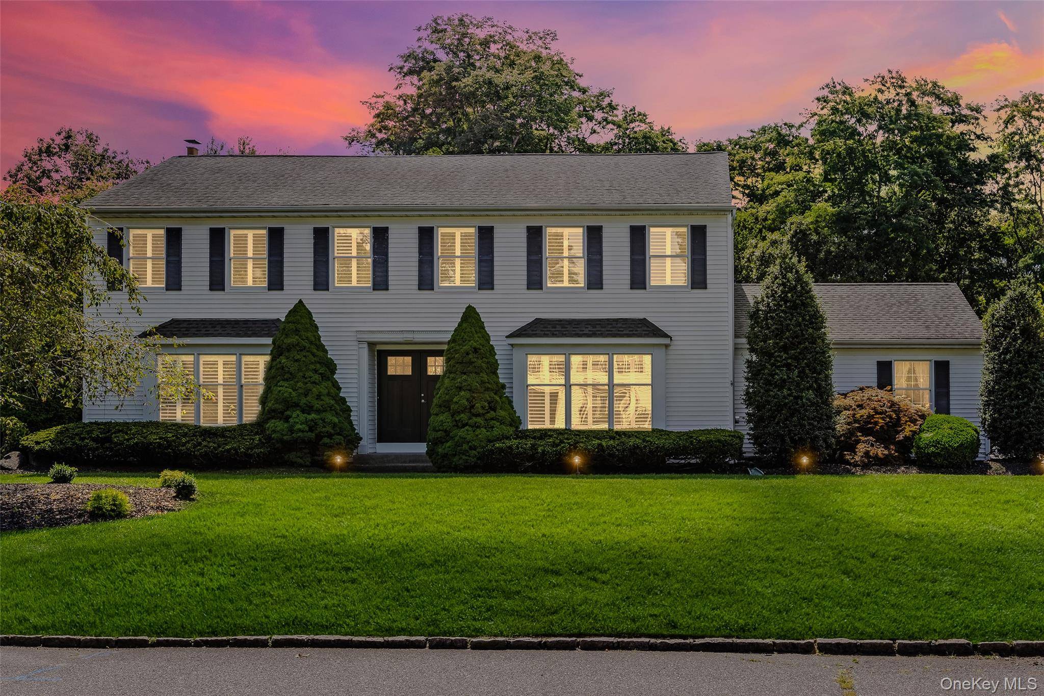 Welcome to Your Dream Colonial in Three Village Woods Imagine coming home to timeless elegance, modern comforts, and a backyard built for unforgettable moments.