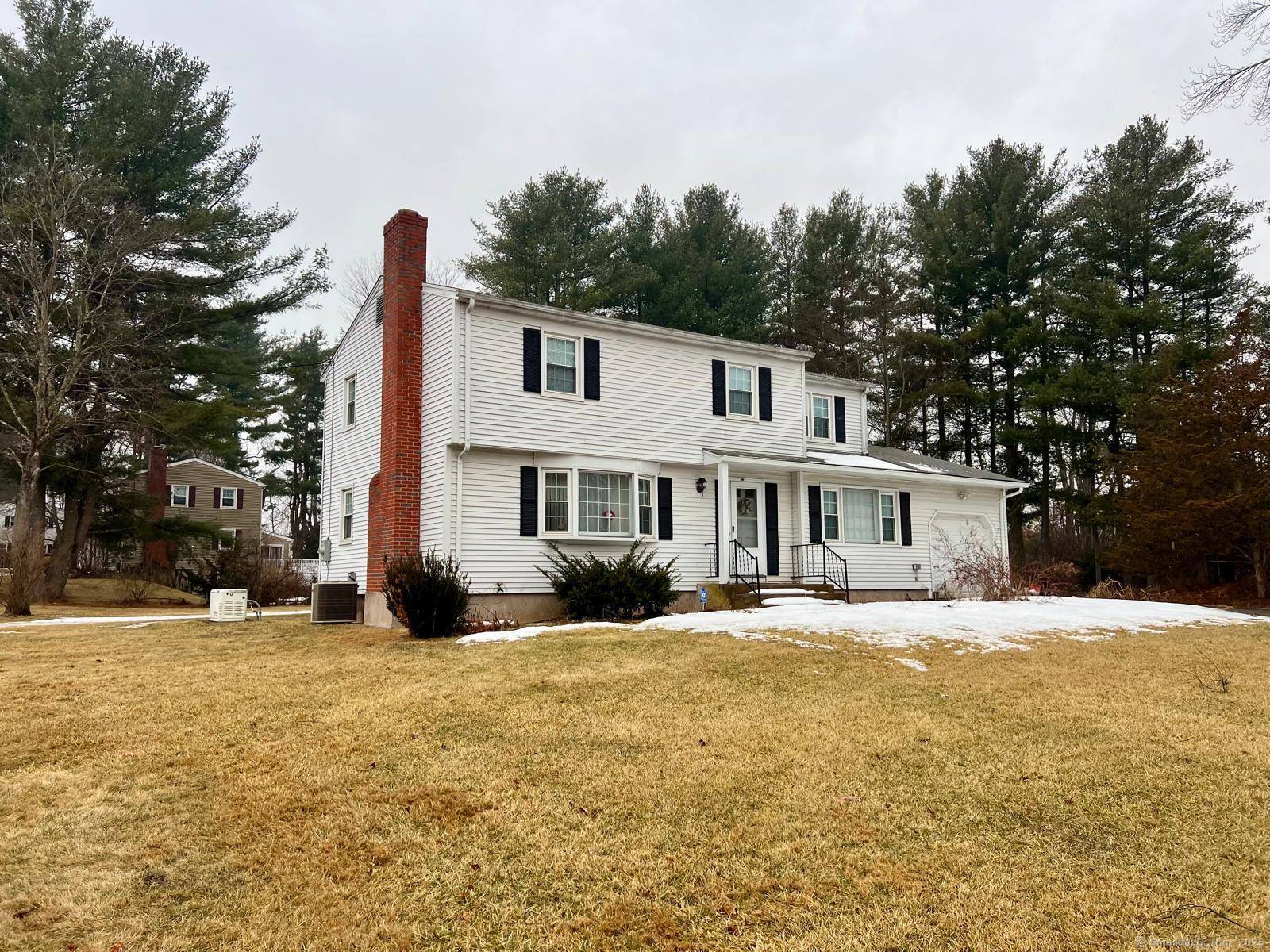Colonial style home with 4 bedrooms and two and a half bathrooms.