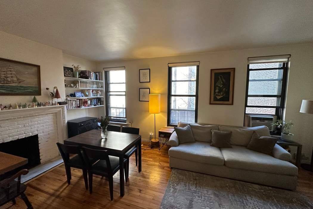 Chelsea Historic West 22nd Street, Beautiful Floor Thru Townhouse Partially Renovated Two bedroom with 1 bathroom, High ceilings, Wood floors, Sunny Southern Bedrooms facing tree lined block, Wood Burning Fireplace, ...