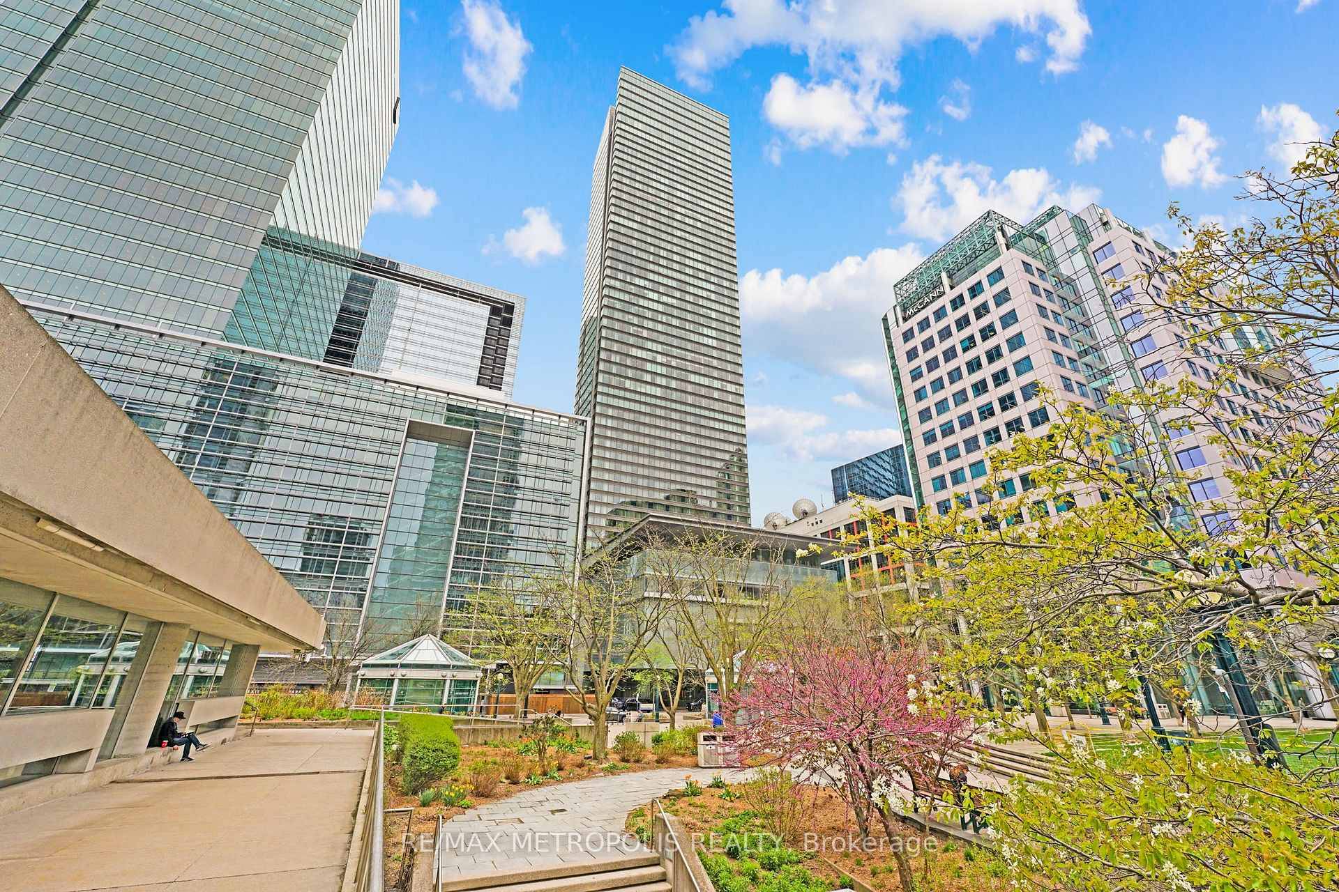 Welcome to a world of elevated elegance in this exceptional 2 bedroom, 2 bathroom corner suite, perched high above the city in one of Toronto's most prestigious addresses.