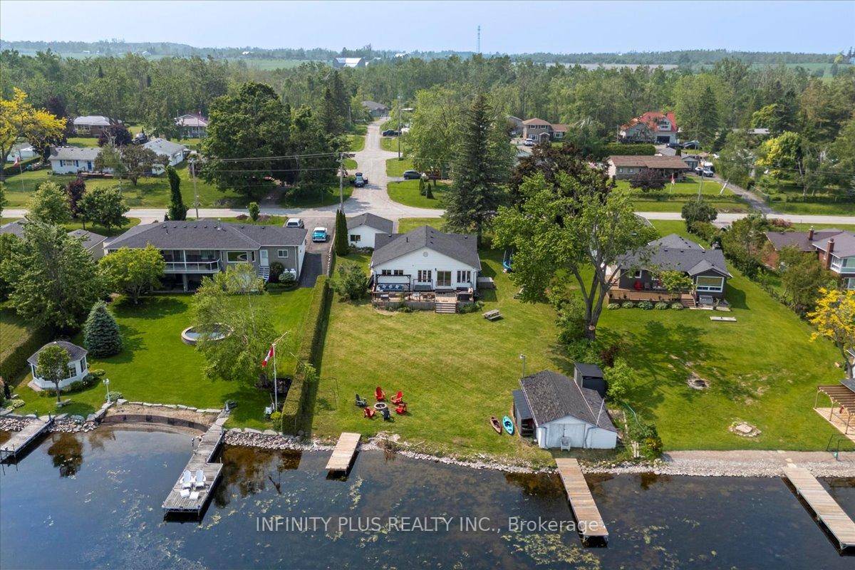 Experience elevated waterfront living in this exquisitely crafted cottage bungalow, where timeless charm meets modern luxury.