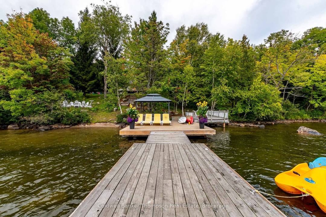 Welcome to 415 Grassmere Resort Rd, a true haven nestled on lovely Peninsula Lake, a part of Huntsville's 4 lake chain, boasting over 40 miles of aquatic adventures.