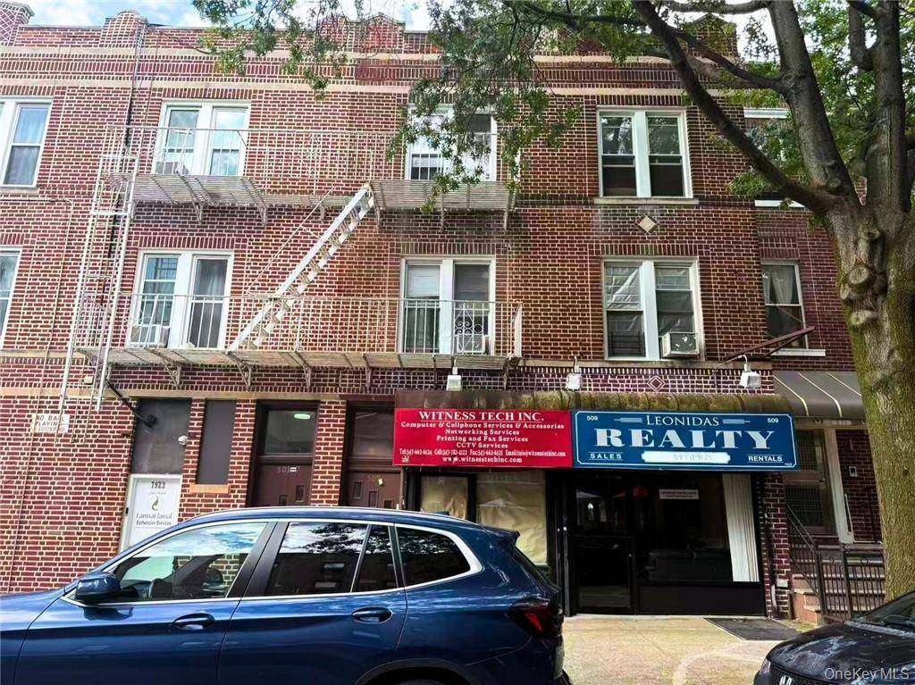 This three story attached brick building offers a versatile mixed use layout with 2 commercial storefronts on the ground level and 2 residential units above.