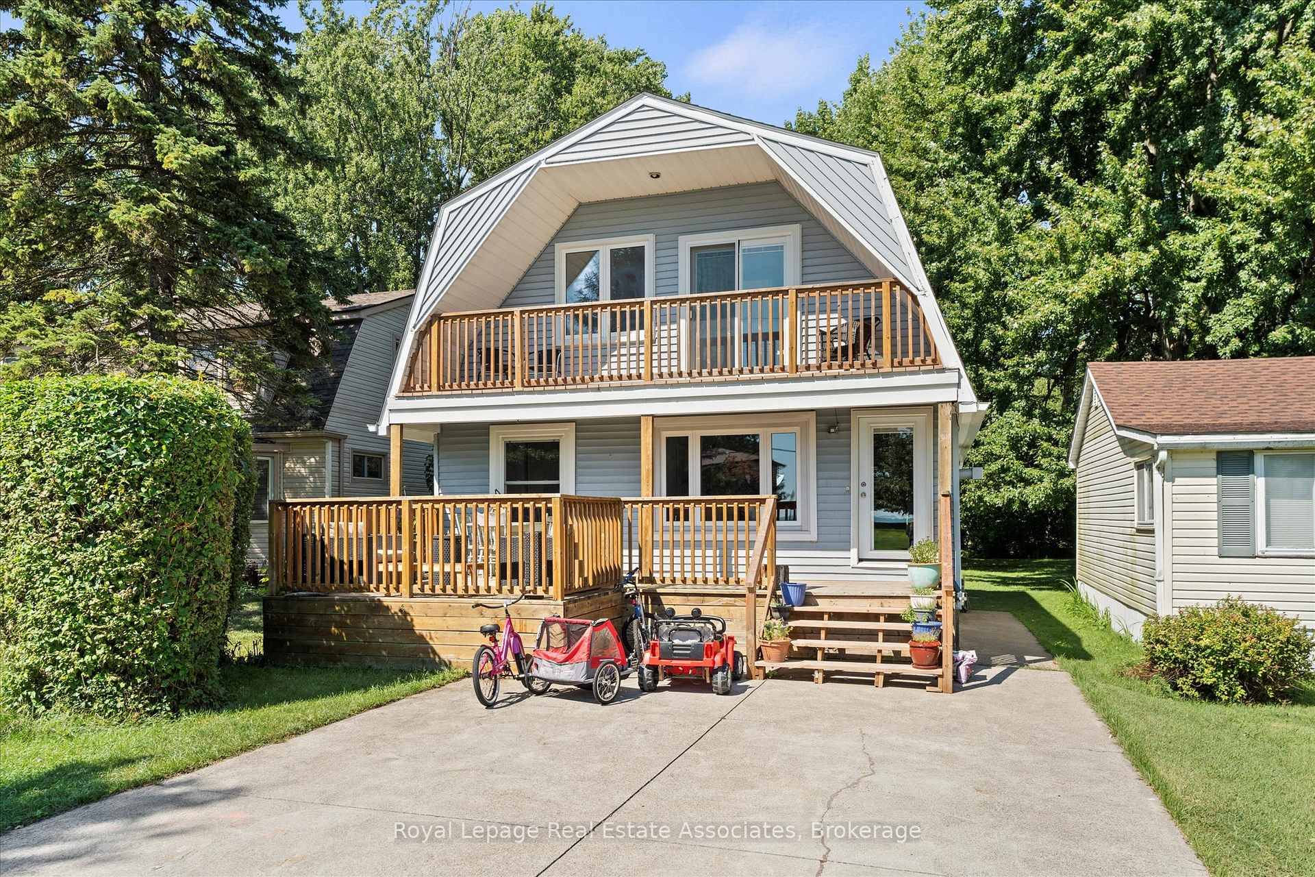 Welcome to This charming 2 bedroom home is the perfect blend of character and modern updates, ideally located just steps from the Sandy beach and backing onto serene green with ...