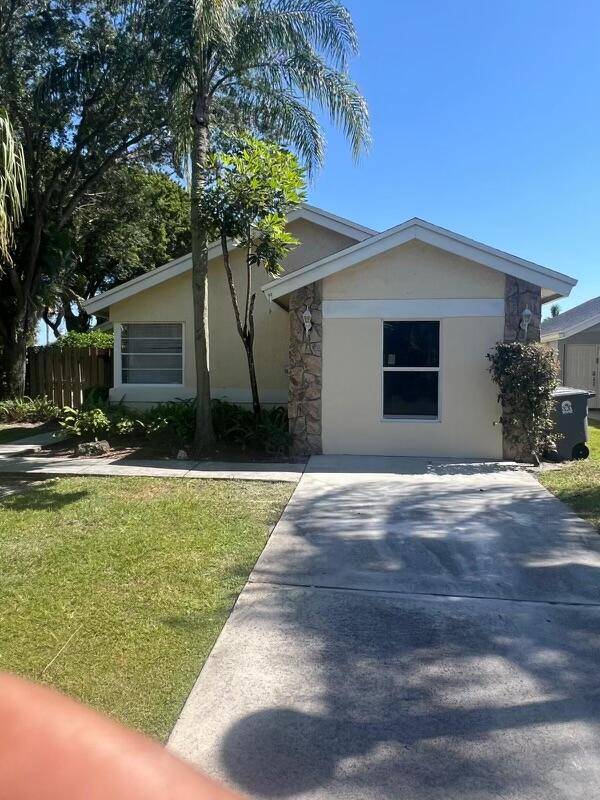 Three bedroom two bath corner home with large side lot one car garage home has just been totally renovated brand new tile, flooring, painting.