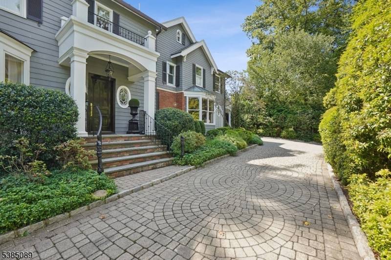 Less than 20 mi from NYC, this impeccably maintained luxury estate, situated on over 2 acres within the prestigious gated community of Llewellyn Park offers unparalleled privacy sophistication.
