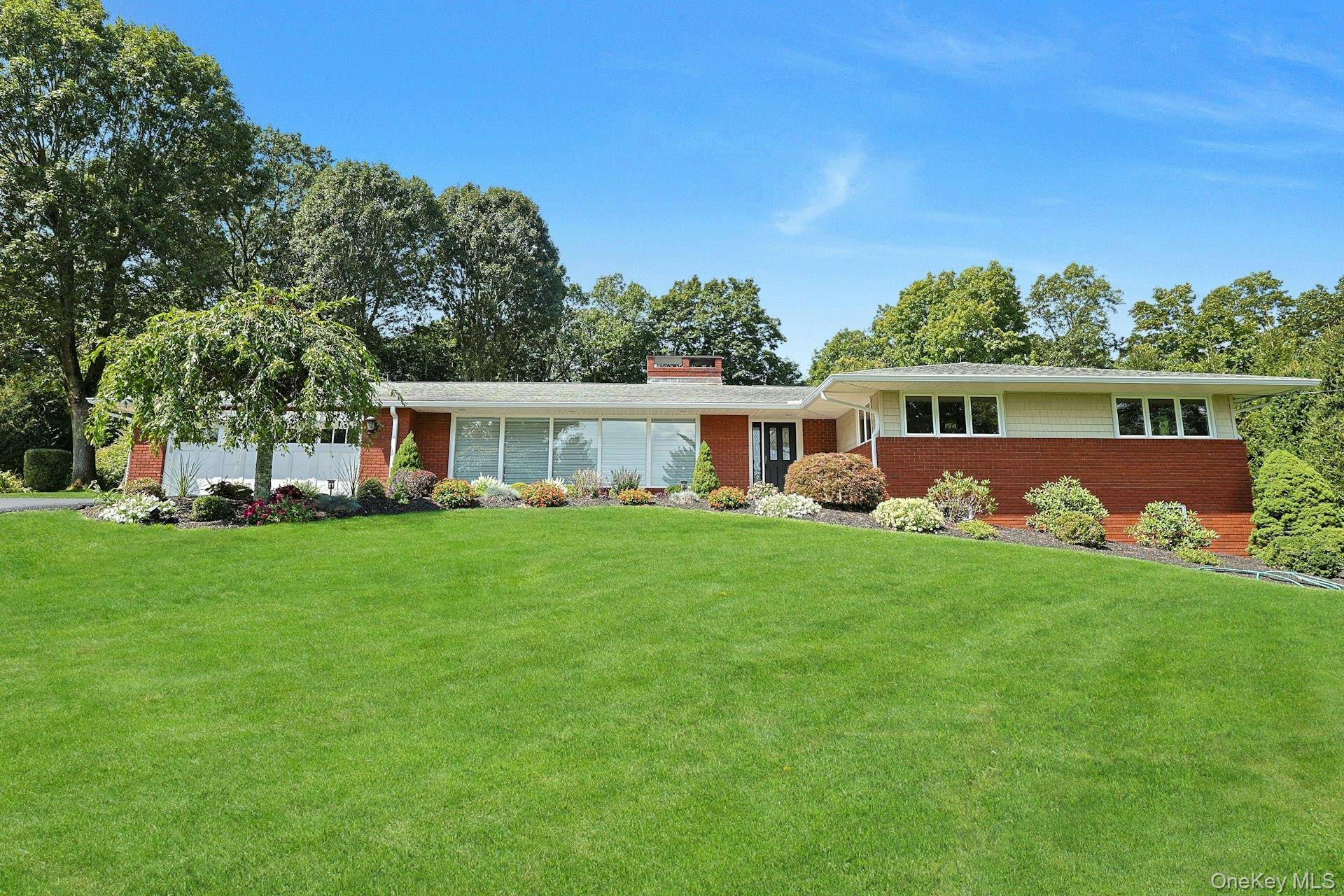 Welcome to this stately brick executive home set on a beautiful acre in sought after Rolling Hills.