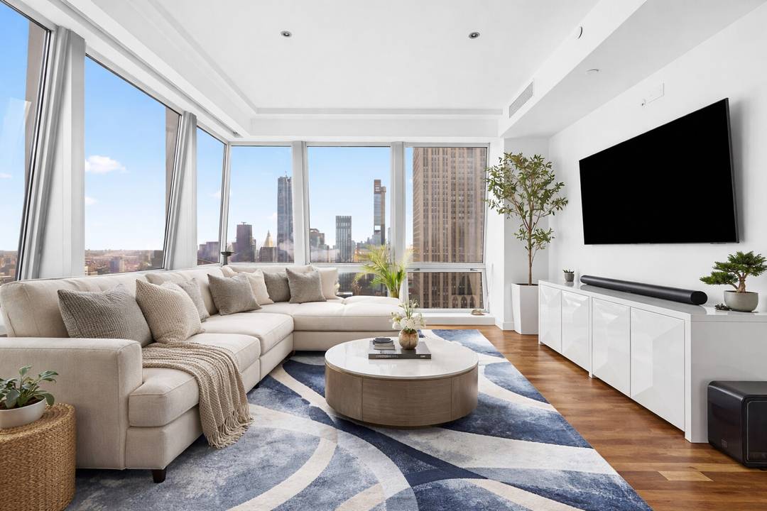 Perched high above Fifth Avenue, Residence 46A is a striking corner two bedroom, two and a half bathroom home offering breathtaking, unobstructed views of the Empire State Building, Chrysler Building, ...