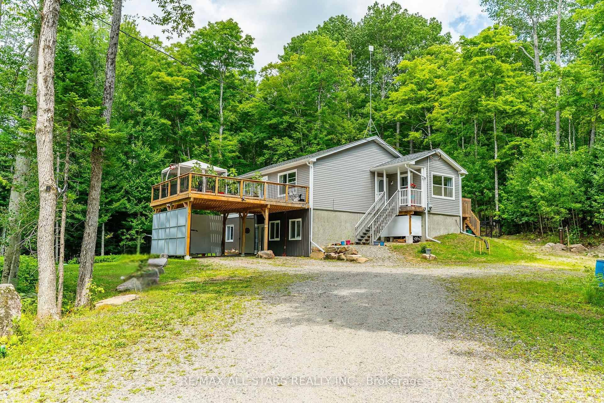 Tucked away on a quiet township road just 10 minutes form Haliburton, this well maintained raised bungalow offers the perfect mix of comfort, privacy, and outdoor adventure.