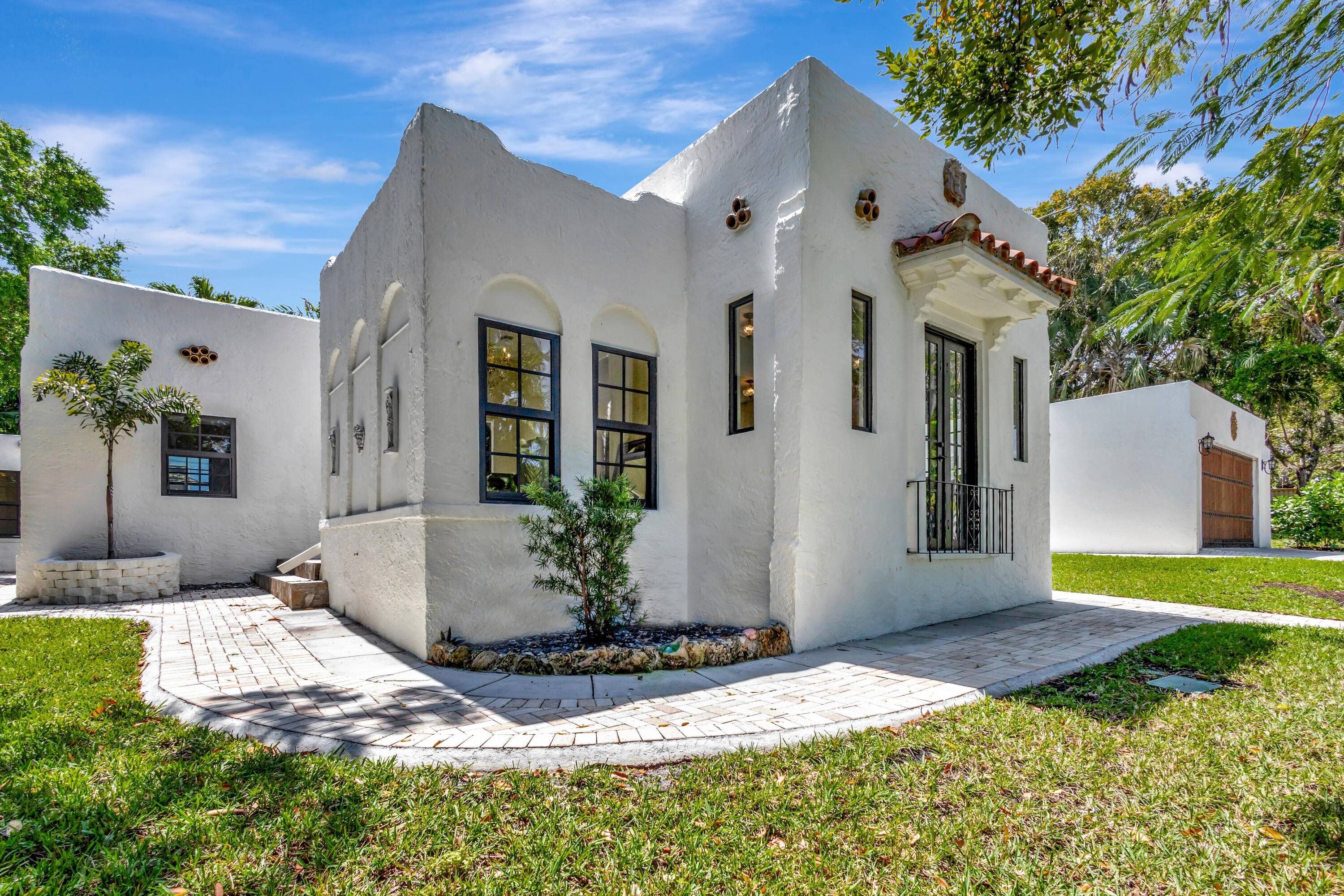 This fully furnished 1926 Spanish Mission style pool home in Historic Northwood Hills offers the perfect fusion of timeless charm and modern convenience, all set on an oversized double lot.