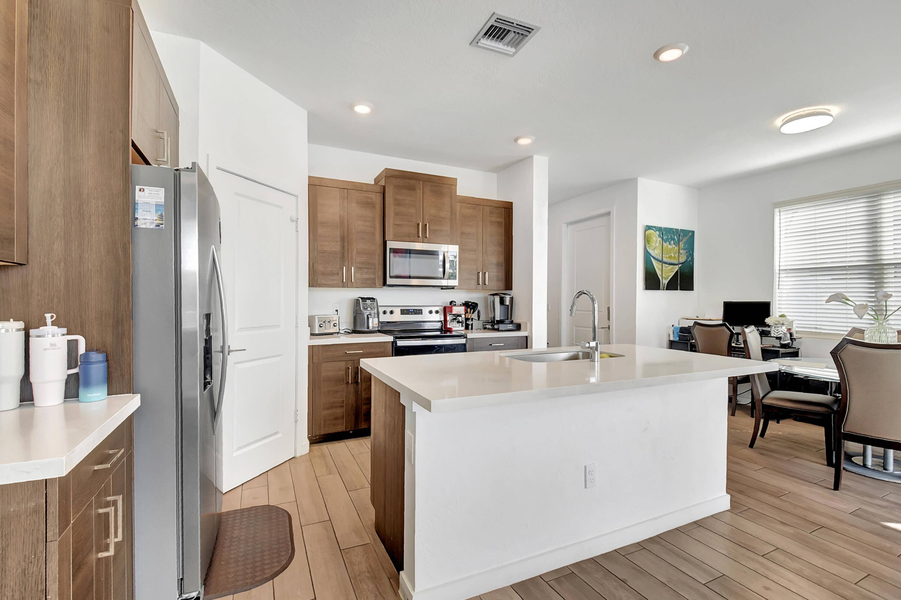 Welcome to your dream home at 8606 Via Mar Rosso, a large fenced backyard with an amazing lake view nestled in the picturesque community of Lake Worth, Florida.