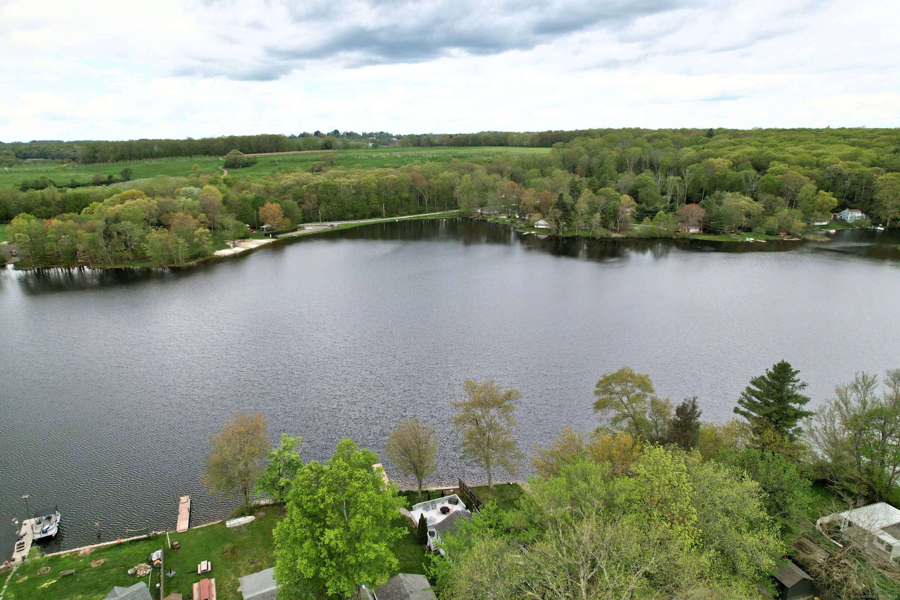 Direct water front experience year round comfort and sunsets in this charming renovated home on Long Meadow Pond.