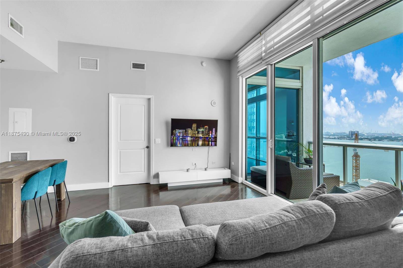 Step into this light filled PENTHOUSE residence in Edgewater, 11 ft floor to ceiling impact glass windows frame breathtaking views.