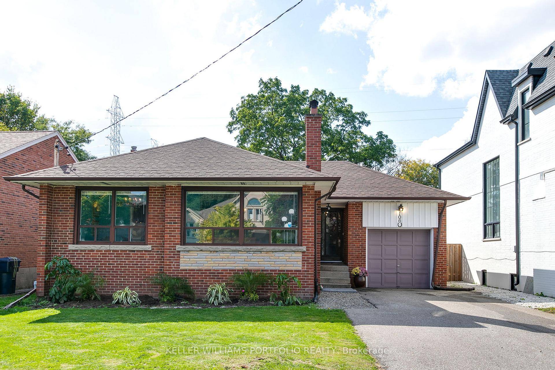 This cherished mid century bungalow stands ready for a creative new owner to refresh its spacious interiors.