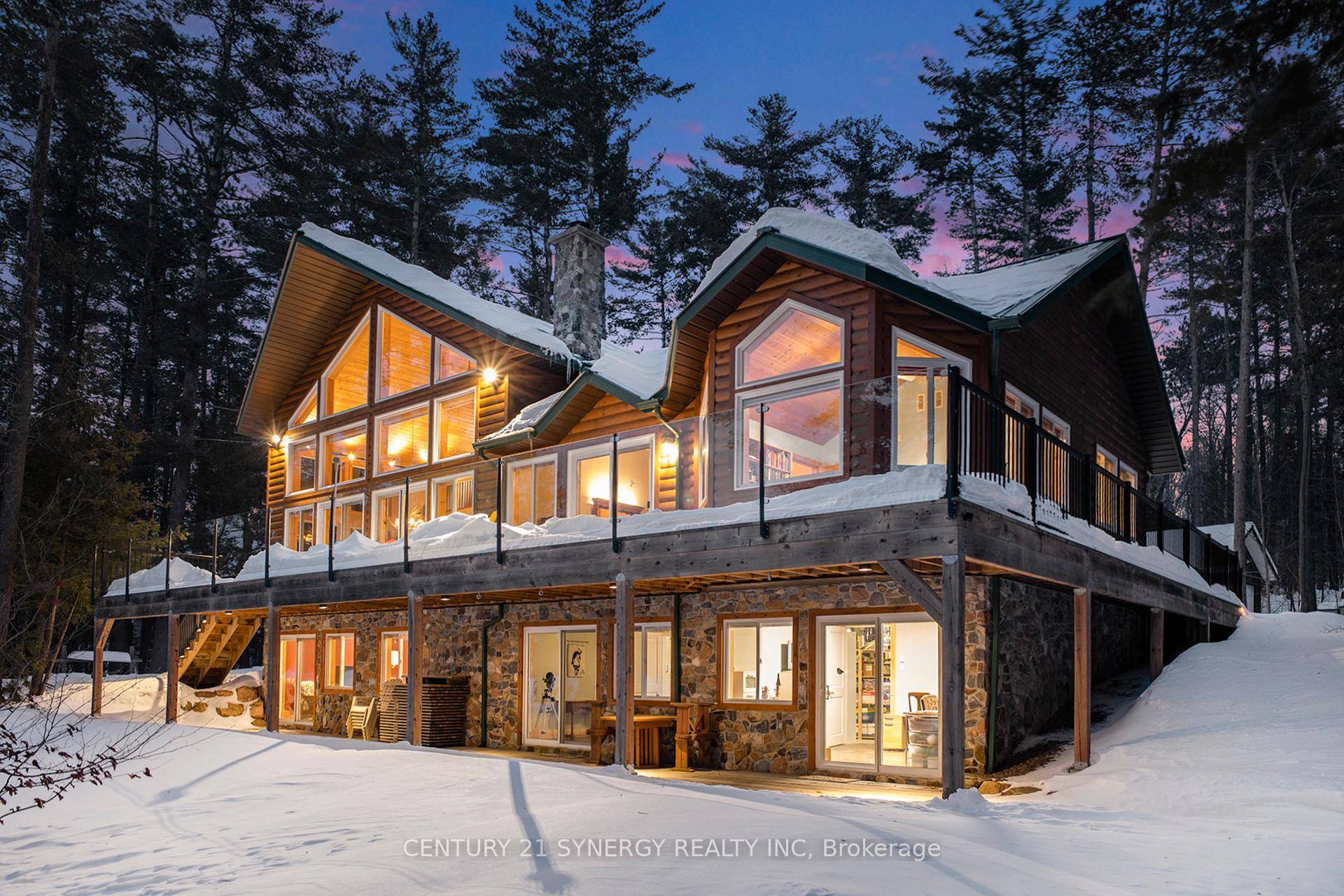 Set on a picturesque 1. 73 acre lot with 315 feet of west facing shoreline, this custom home features a main level great room with a soaring 21 foot cathedral ...