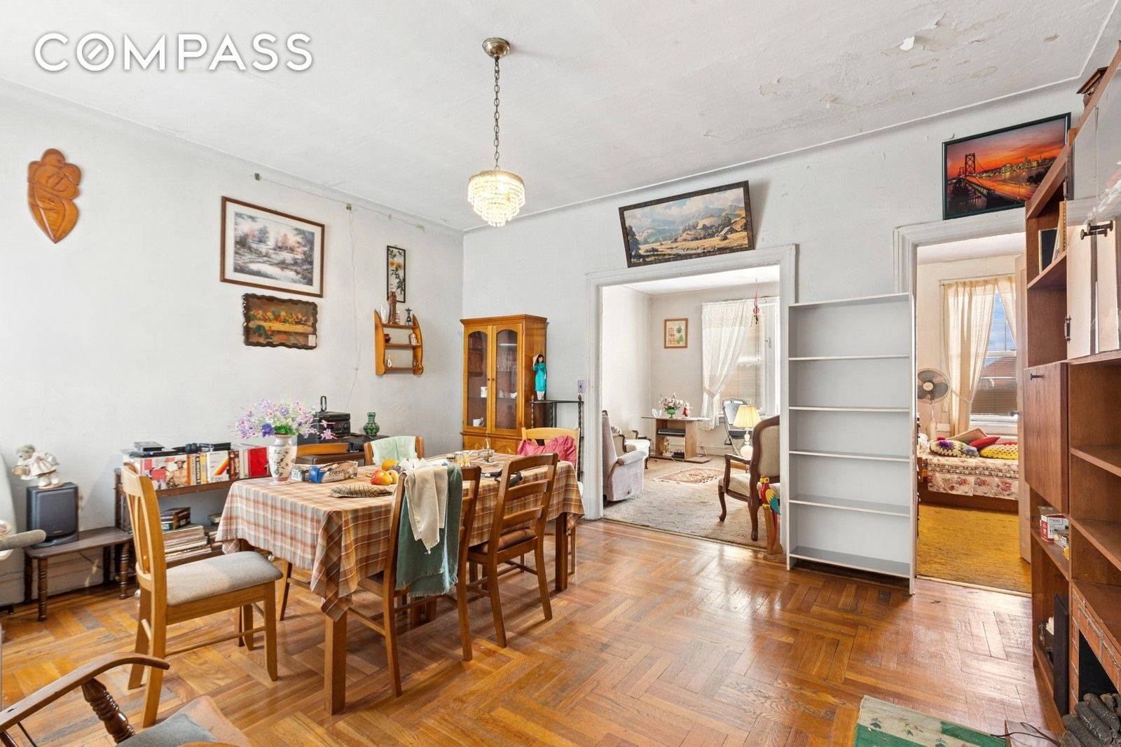 5606 Snyder Avenue is a classic 1935 brick row house brimming with original architectural details and flexible potential.