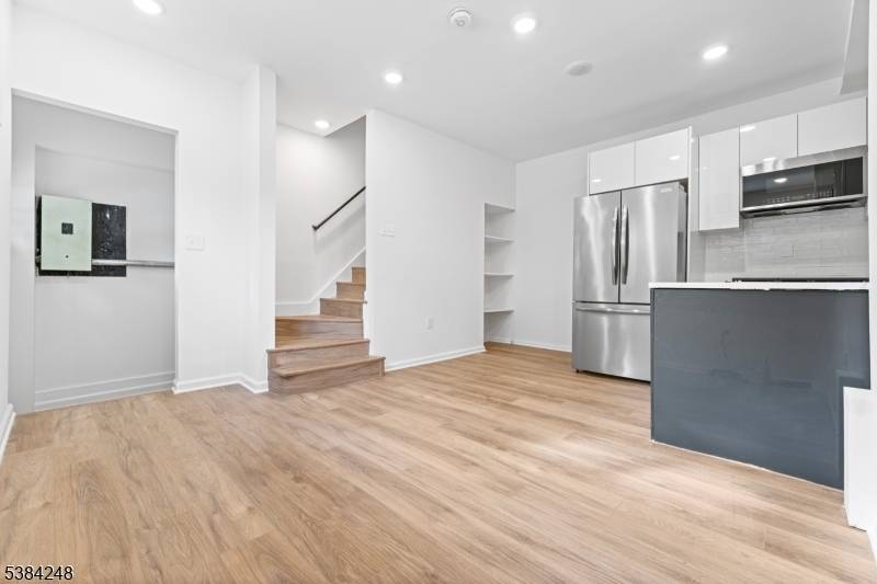 Fully renovated attached end unit brick town home with no HOA, located in the heart of Weehawken.