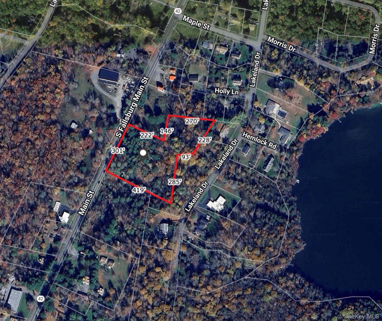 This vacant lot has over 300 feet of Route 42 road frontage and is being combined and sold with the adjacent 2.