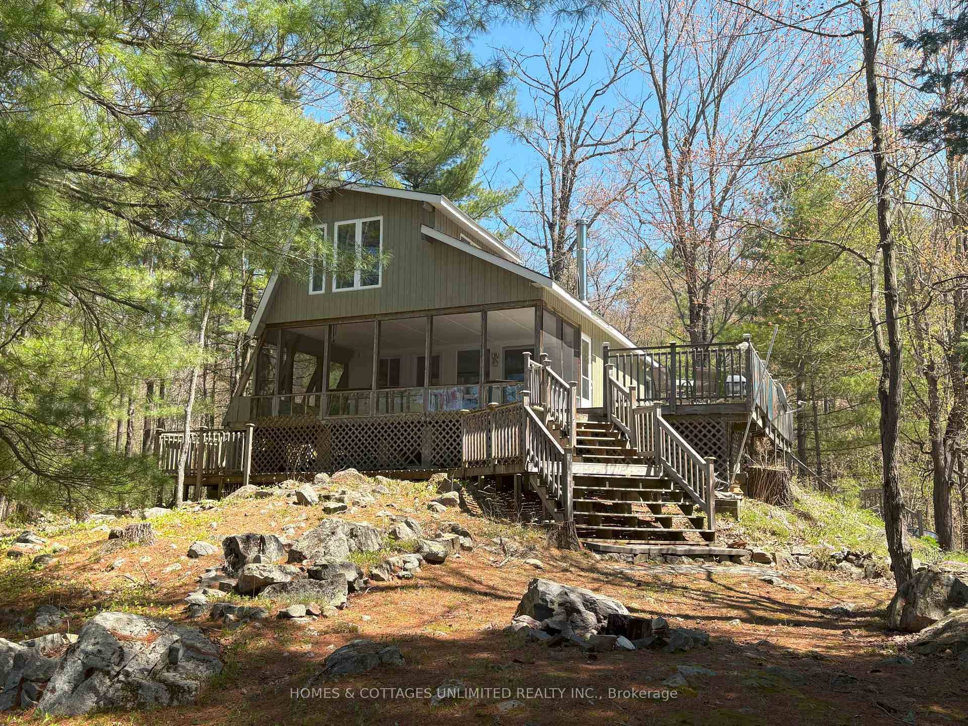 This cherished cottage, built amp ; held in the same family for 57 years, is nestled on nearly an acre of natural beauty along the serene, spring fed Bagot Long ...