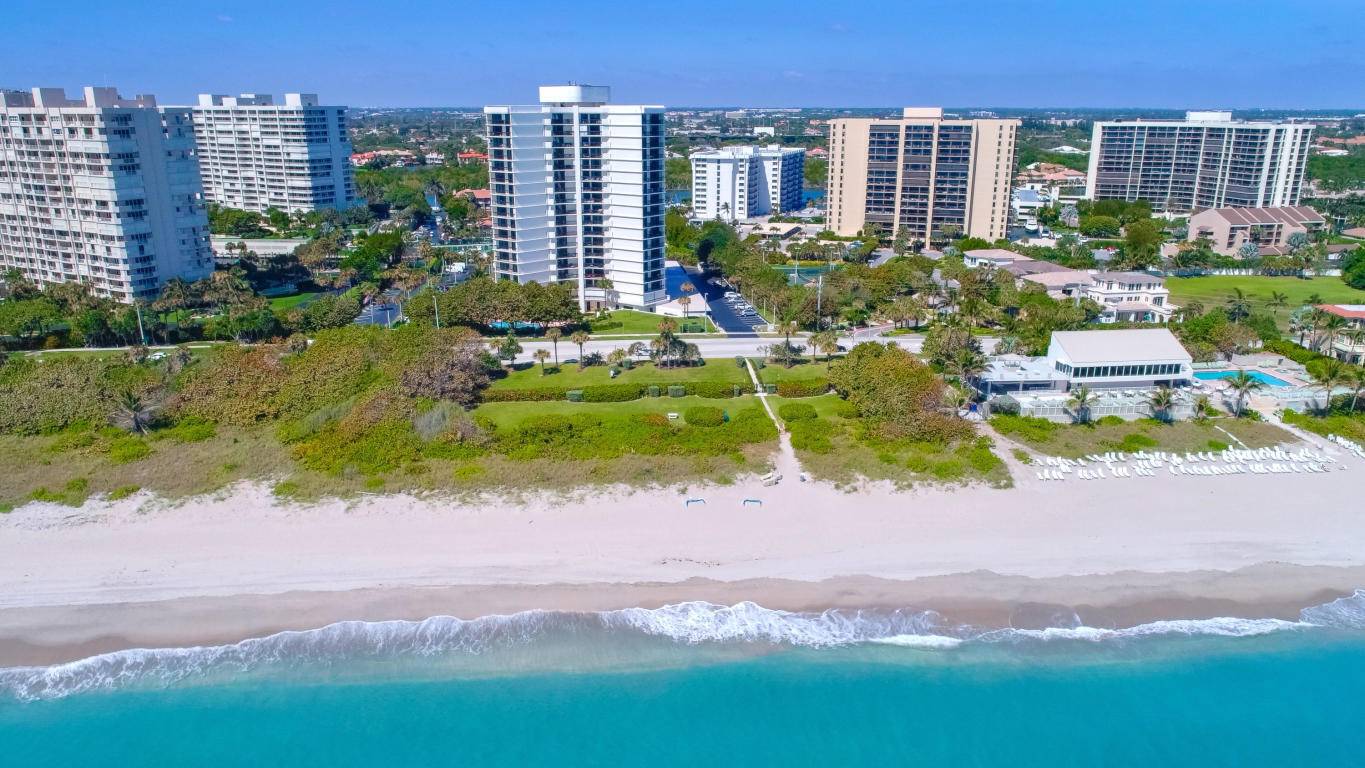Impressive S E W panoramic direct ocean, intracoastal city views from this corner seaside residence.