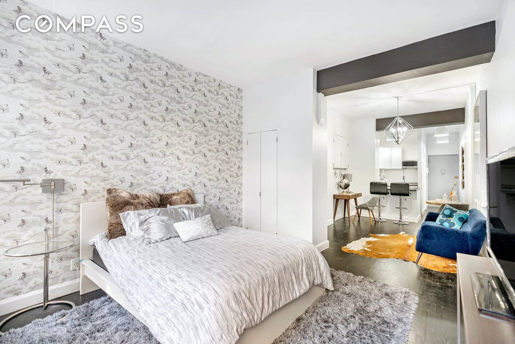 Superbly renovated, this stylish and bright studio features an open floor plan for loft style living, plus soaring 11 foot ceilings.