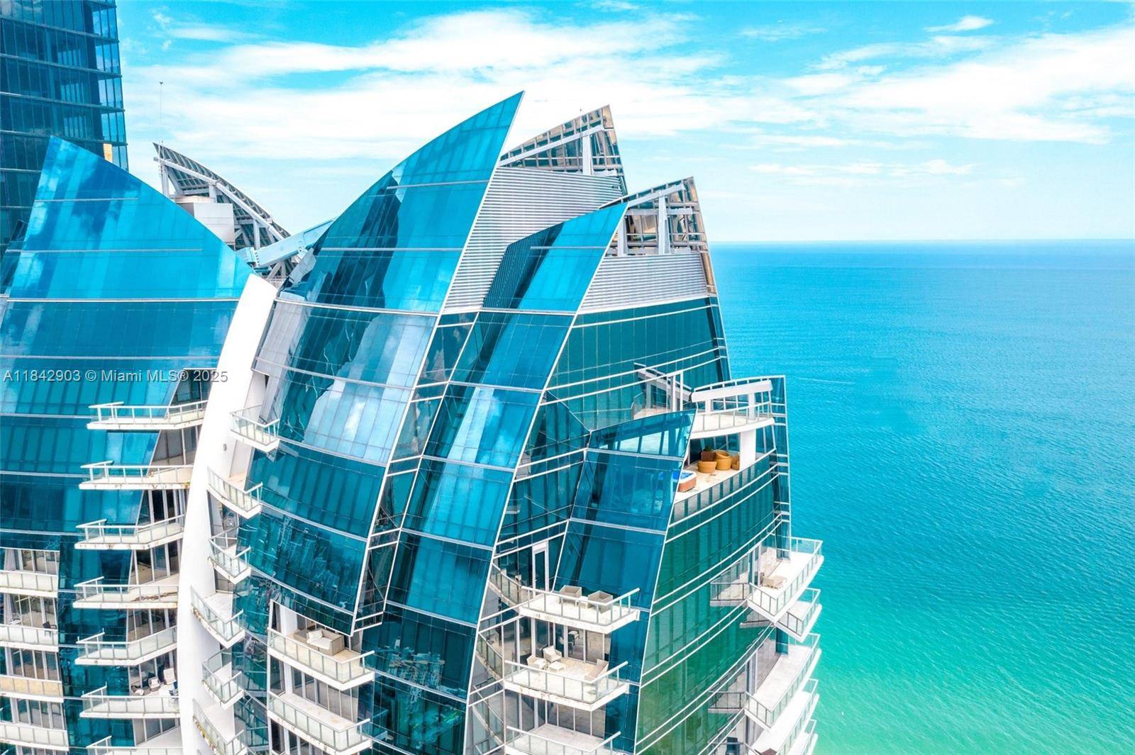 Luxuriate in this fully renovated 8, 332 sqft Penthouse in Sunny Isles with direct ocean views.
