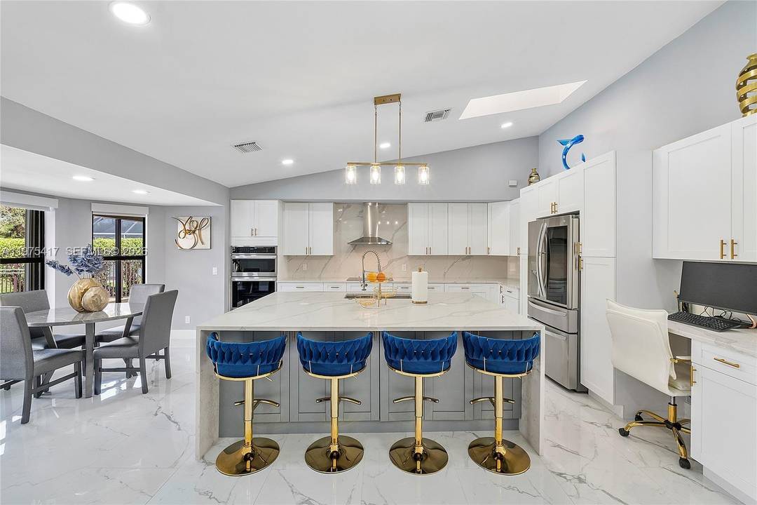 PRICE IMPROVEMENT Experience refined waterfront living in this pristine 4 bedroom, 3 bath pool home located in Pine Ridge.