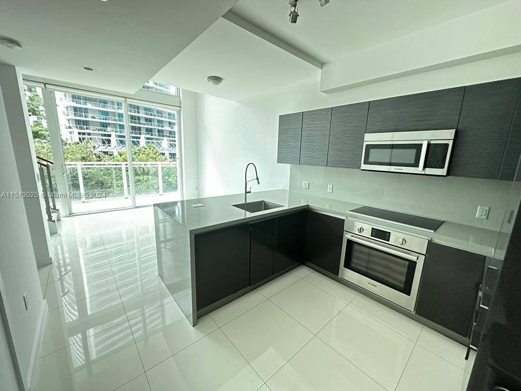 AMAZING 2 STORY RESIDENCE AT THE BOND BRICKELL FEATURING NEW PORCELAIN FLOORS, TOP OF THE LINE APPLIANCES, CUSTOM MADE ITALIAN BUILT IN CLOSETS, BLINDS AND MORE !