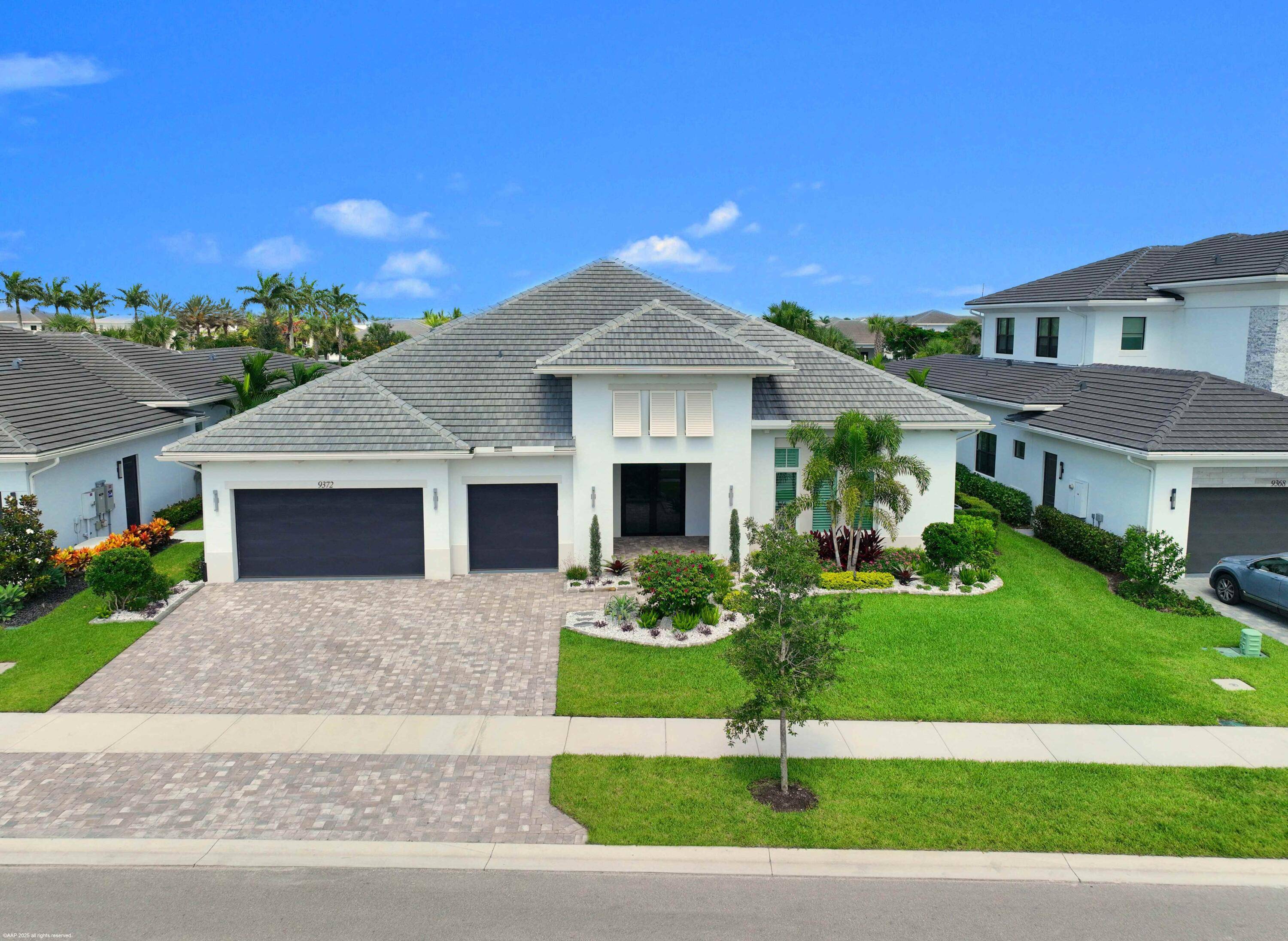 Experience refined Florida living in this exquisite 5 bedroom, 4.