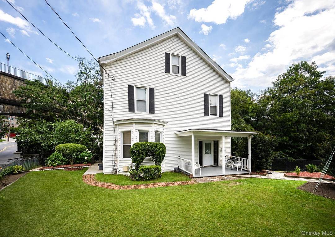 This Colonial TWO FAMILY dwelling is located in the heart of the village.