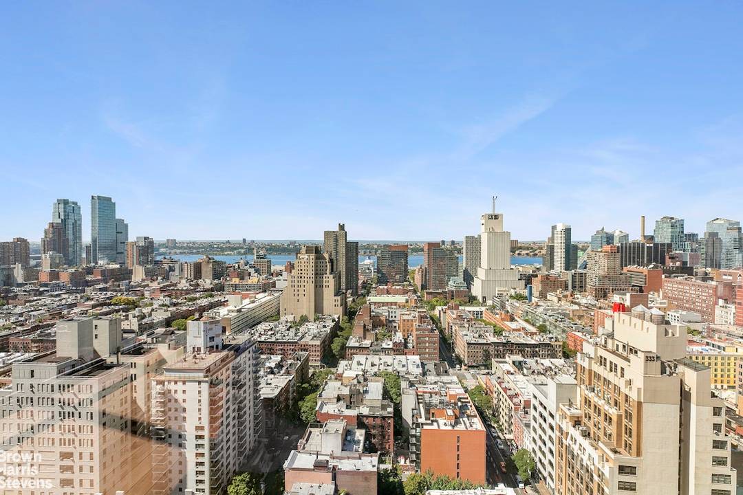 Perched high above Midtown, Residence 28B at The Link Condominium is a sun filled, corner two bedroom, two and a half bath spanning over 1, 300 SF.
