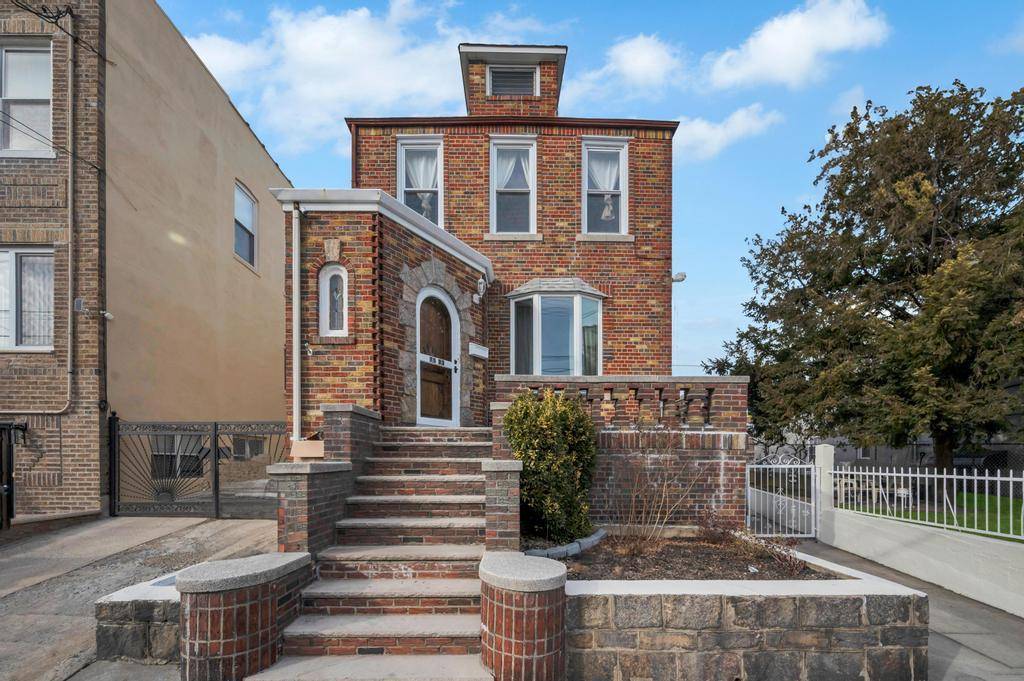 Spacious Fully Detached Two Family Brick Home with Extra Lot and Endless Possibilities.