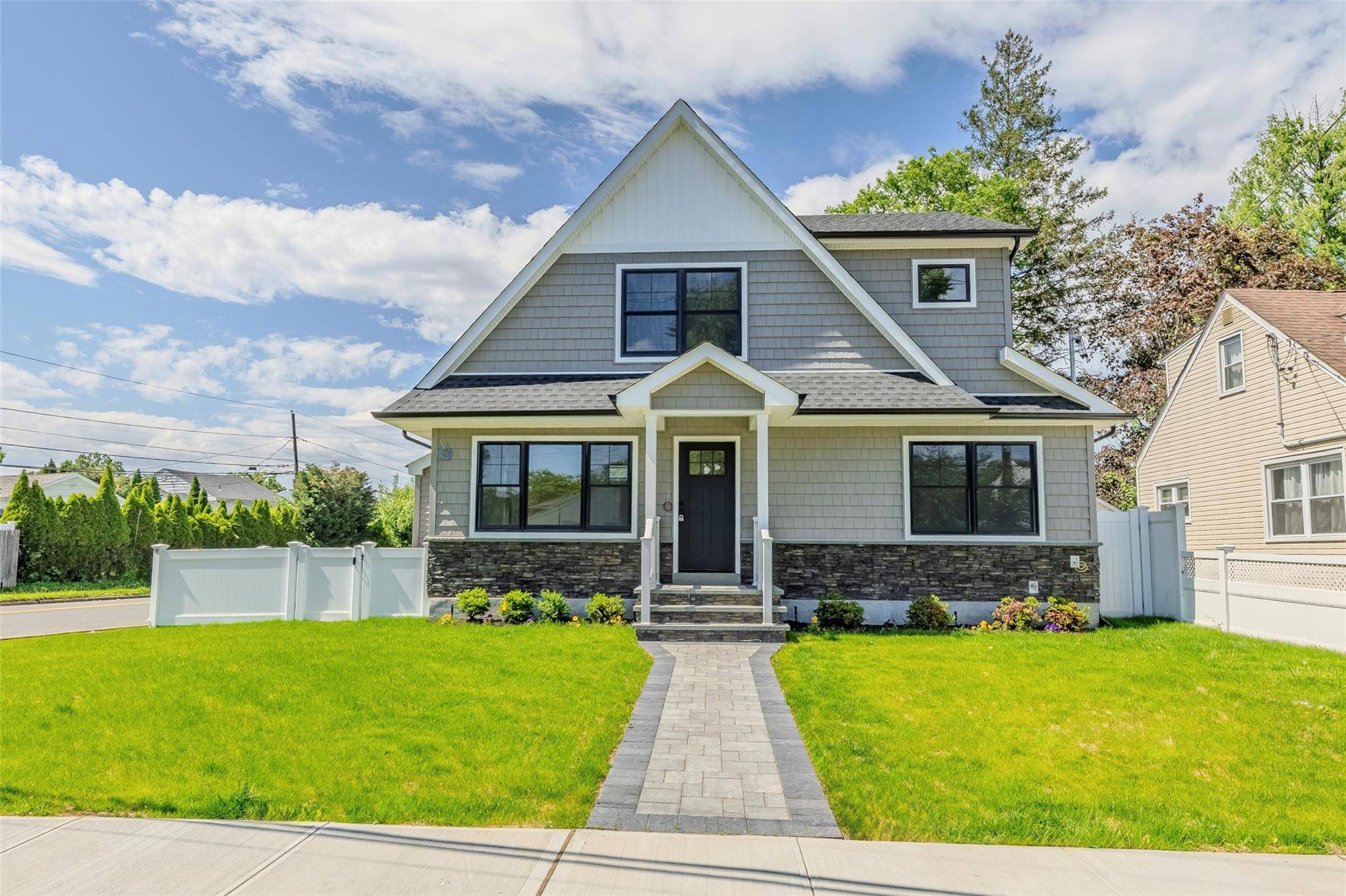Totally reconstructed 4 bedroom 3 bathroom colonial with large rear extension and expanded basement footprint with outside entrance.