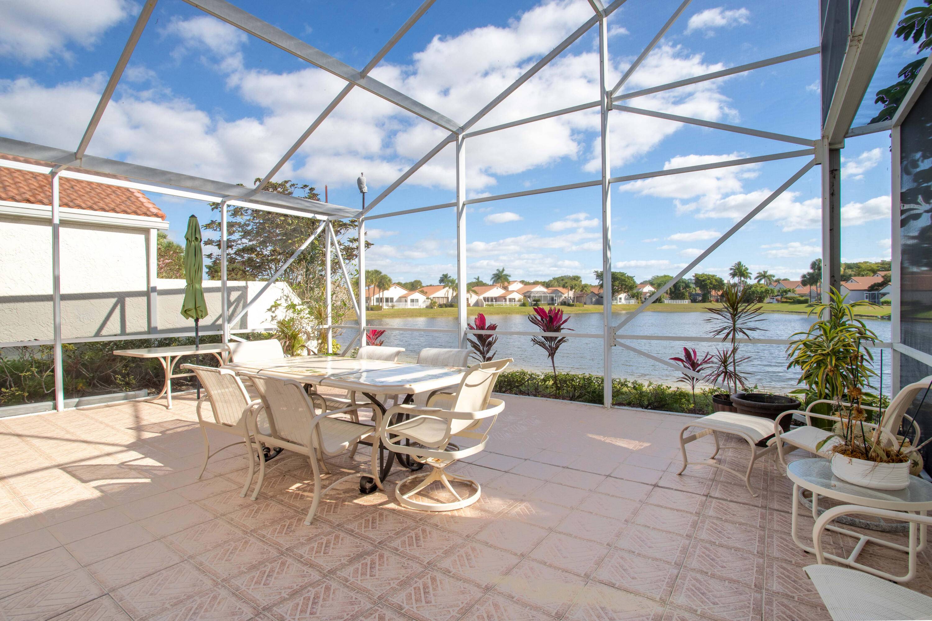 Fabulous light and bright single family waterfront home located in the desirable Boca Pointe gated non mandatory country club community.