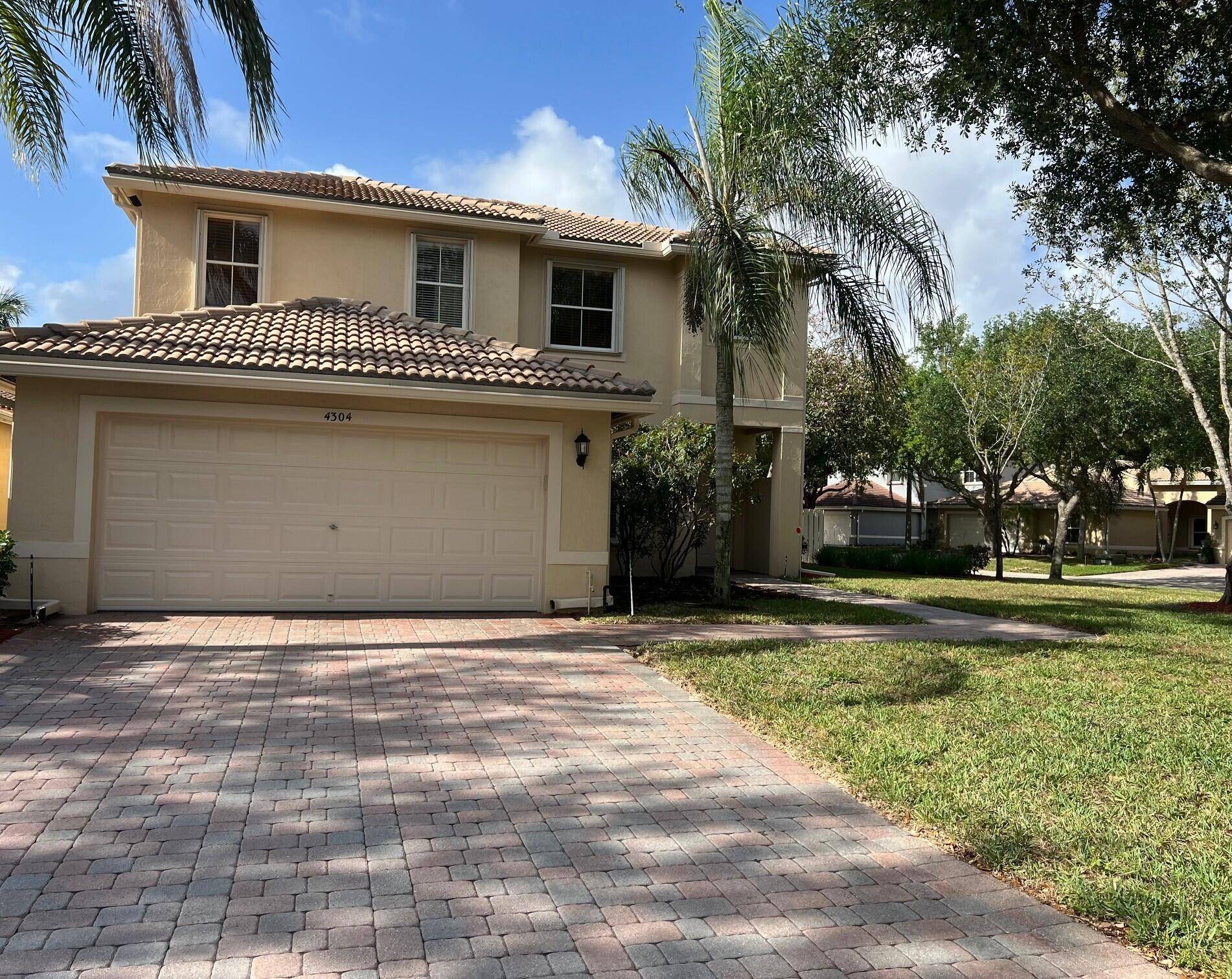 Welcome to this stunning corner unit, two story home featuring a large fenced in yard with an extended paver brick patio.